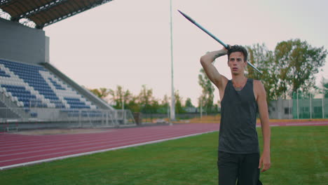 Slow-motion:-a-Male-athlete-at-the-stadium-concentrates-runs-up-and-throws-a-javelin.-Preparation-for-the-Olympic-games-all-around